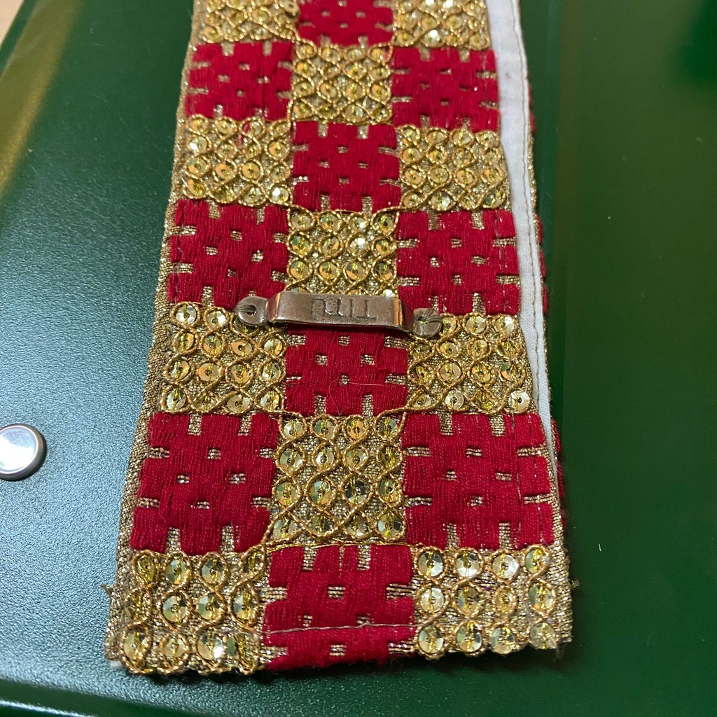 Gold and red checkere belt